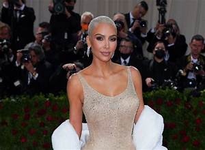 Watch Kim Kardashian Struggle to Climb the Stairs in Skin-Tight Dolce & Gabbana Dress