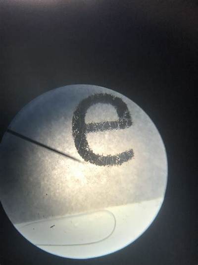 Why Does the Letter E Flip Under a Microscope